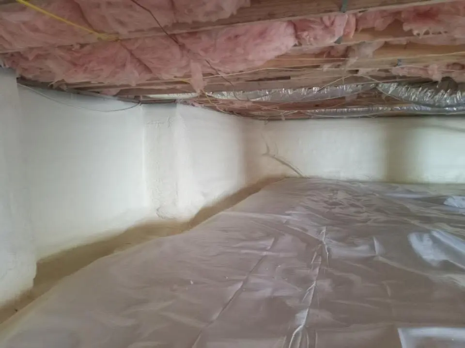 Crawl space encapsulation with closed-cell spray foam for Commercial Roof Restoration in Madison